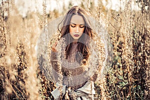 Fashion beautiful lady in autumn landscape