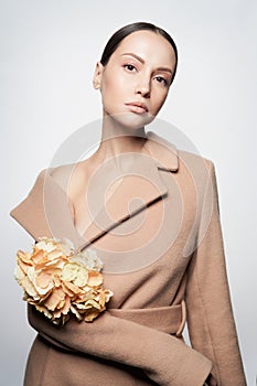 Fashion beautiful lady in beige coat