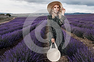 Fashion beautiful model in lavender field in sunset