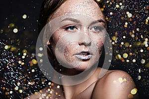 Fashion beauty glamor girl. Face in Glitter Powder. Close-up portrait of a woman