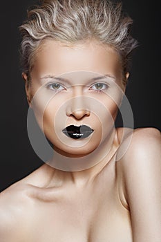 Fashion beauty. Hairstyle, make-up & black lips