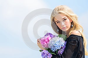 Fashion and beauty industry. Celebrate spring with bouquet. Girl tender fashion model hold hydrangea flowers bouquet