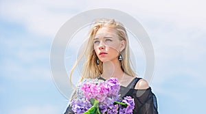 Fashion and beauty industry. Celebrate spring. Girl fashion model carry hydrangea flowers. Spring fresh bouquet