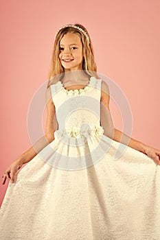 Fashion and beauty, little princess. Fashion model on pink background, beauty. Look, hairdresser, makeup. Child girl in