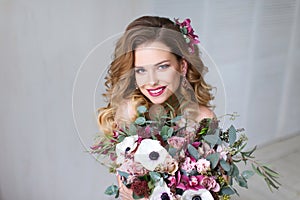 Fashion Beauty Model Girl with Flowers Hair.