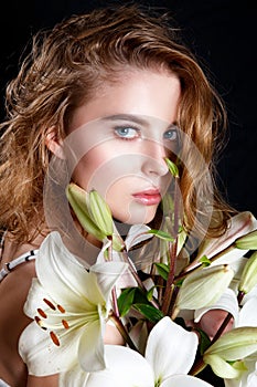 Fashion Beauty Model Girl with Flowers Hair. Perfect natural Make up and Hair Style