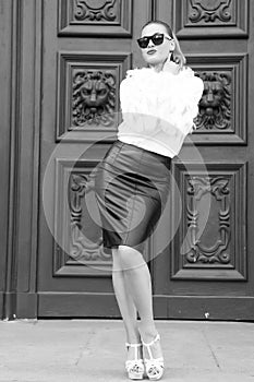 Fashion beauty and vogue. Woman in high heel shoes on red door in paris, france. woman in sunglasses with long hair