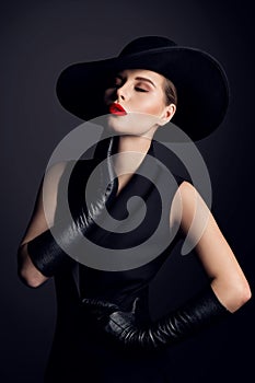 Fashion Beauty Woman Portrait in Hat with Red Lips Make up. Elegant Old fashioned Lady in Gloves dreaming with Closed Eyes photo