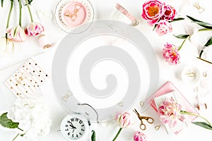 Fashion blog pink style desk with accessories, tulip flowers, scissors, coffee cup on white background. Flat lay. Top