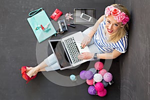 Fashion blogger with computer looking up