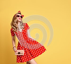 Fashion Blond Girl in Red Polka Dots Dress. Outfit