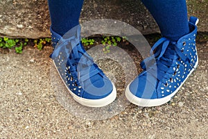 Fashion blue shoes on child's feet