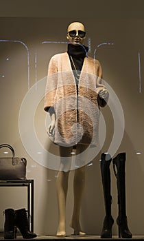 Fashion boutique display window with mannequin, store sale window,woman clothing store window