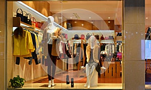 Fashion boutique display window with mannequins, go shopping, dress shop window