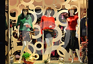 Fashion boutique display window with mannequins, store sale window, front of shop window