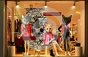 Fashion boutique display window with mannequins, store sale window, front of shop window