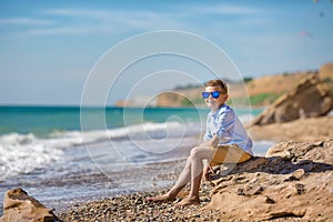 Fashion boy on the beach