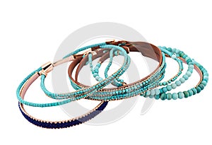 Fashion bracelets with turquoise gemstones and leather isolated on white