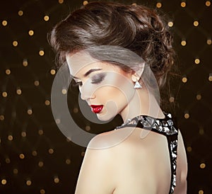 Fashion Brunette Model Portrait. Jewelry and Hairstyle. Elegant