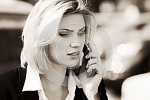 Fashion business woman calling on cell phone outdoor