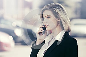 Fashion business woman calling on cell phone outdoor