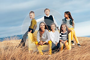 Fashion children in autumn field