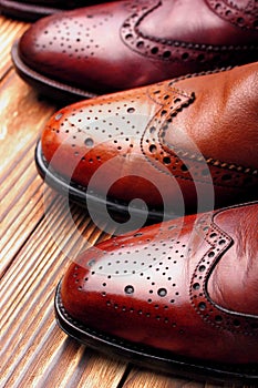 Fashion classical polished men`s shades of brown oxford brogues.Selective focus