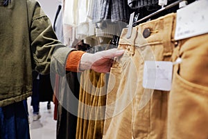 Fashion and Cloth for Women. Croped image of Female choosing Pan
