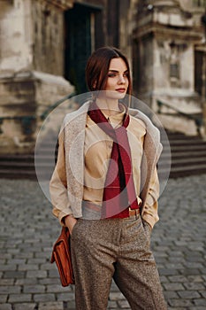 Fashion Clothes. Beautiful Woman In Fashionable Clothing Outdoor