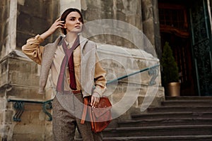 Fashion Clothes. Beautiful Woman In Fashionable Clothing Outdoor