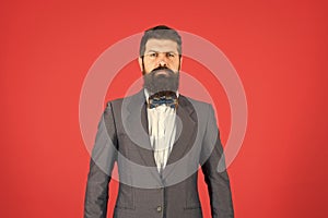 Fashion concept. Businessman or host fashionable outfit red background. Formal outfit. Confident posture. Man bearded