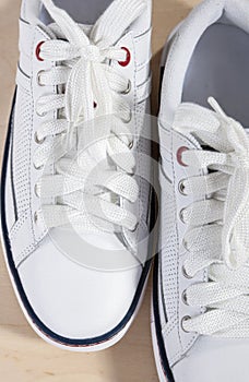 Fashion Concept and Ideas. Closeup of Pair of White Fashionable Trainers