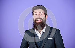 Fashion concept. Impeccable style. Businessman fashionable outfit stand violet background. Man bearded hipster wear