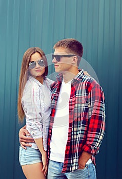 Fashion concept - portrait of stylish confident young couple