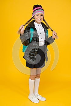 Fashion concept. Warm clothing. Buy clothes for school season. Schoolgirl fashion outfit. Fall autumn winter. Child with