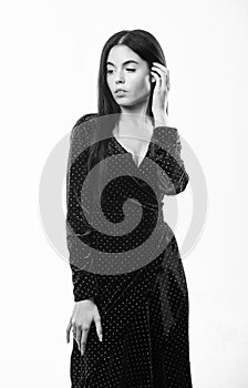 Fashion concept. Woman dress polka dot pattern. Woman elegant lady with makeup long hair wear velvet dark dress with