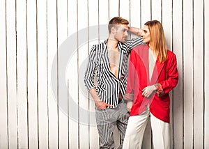 Fashion couple posing in the studio, Vogue style