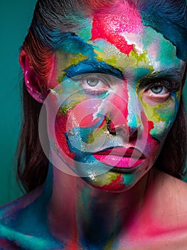 Fashion and creative makeup, young beautiful woman abstract face art.
