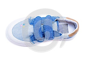 Fashion denim baby shoes for the toddlers feet. Kids sneakers isolated on white background.