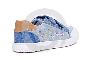 Fashion denim baby shoes for the toddlers feet. Kids sneakers isolated on white background.