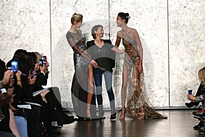 Fashion designer Inbal Dror (C) and models walk at Inbal Dror Bridal Fall Winter 2016 Runway Show