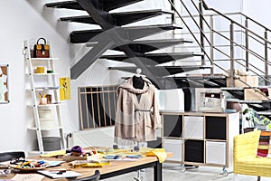 Fashion designer`s workplace . Creating new clothes