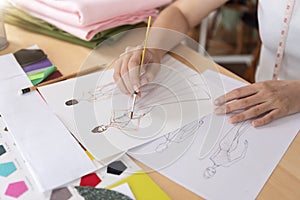 Fashion designer stylish drawings sketches textile fabric material Costume. Designer creative workshop studio