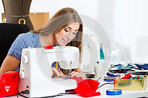 Fashion designer or tailor working in studio