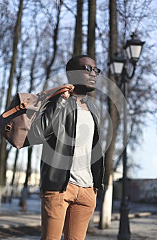 Fashion elegant young african man wearing a black leather jacket