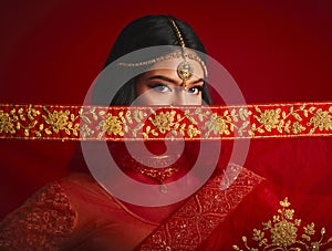 Fashion, eyes and portrait of Indian woman with veil in traditional clothes, jewellery and sari. Religion, beauty and