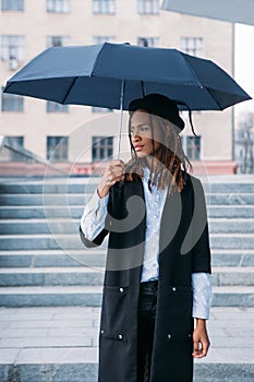 Fashion female model outdoors. Moody weather