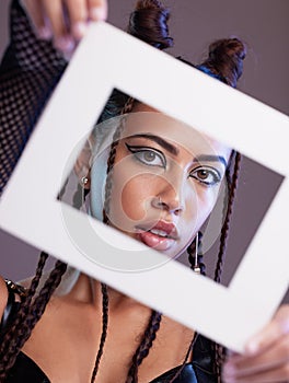 Fashion, frame and portrait of a woman in a studio with a grunge, edgy and goth outfit and makeup. Stylish, beauty and