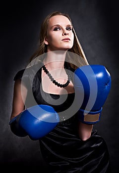 Fashion girl in boxing gloves