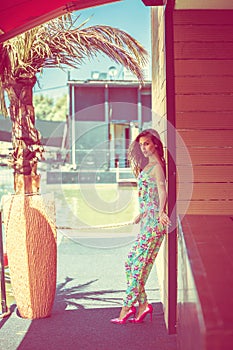 Fashion girl in jumpsuit hot summer day